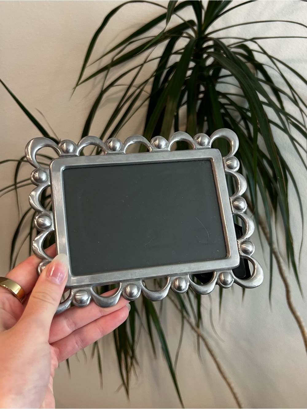 Silver metal vintage frame with ornate scrollwork and beaded detailing